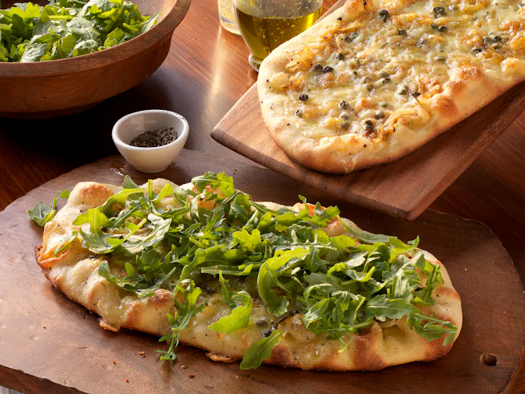 Grilled Pizzas with Brie, Caramelized Onions, and Capers | Starters Recipes