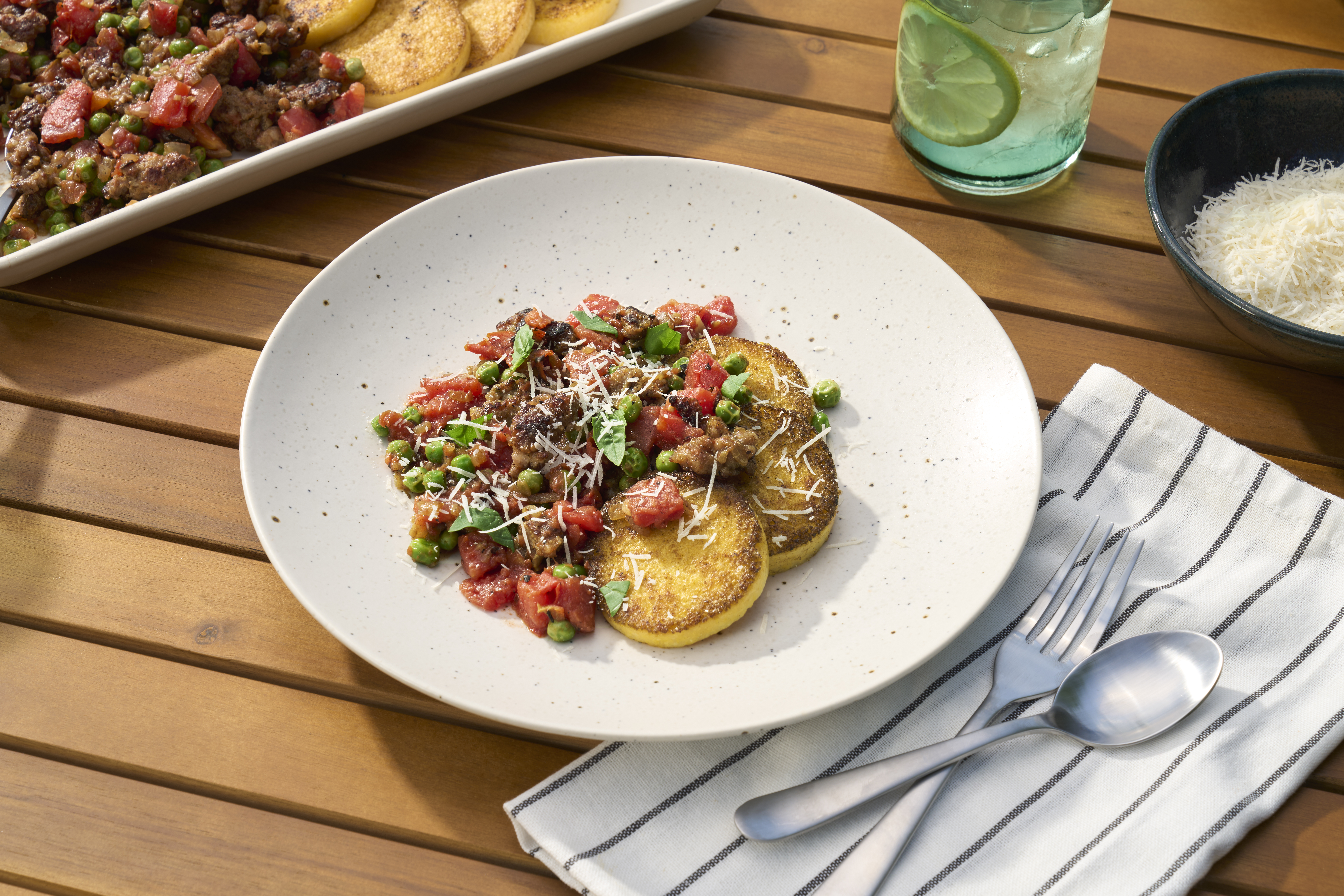Griddled Polenta Cakes with Italian Sausage and Peas 
