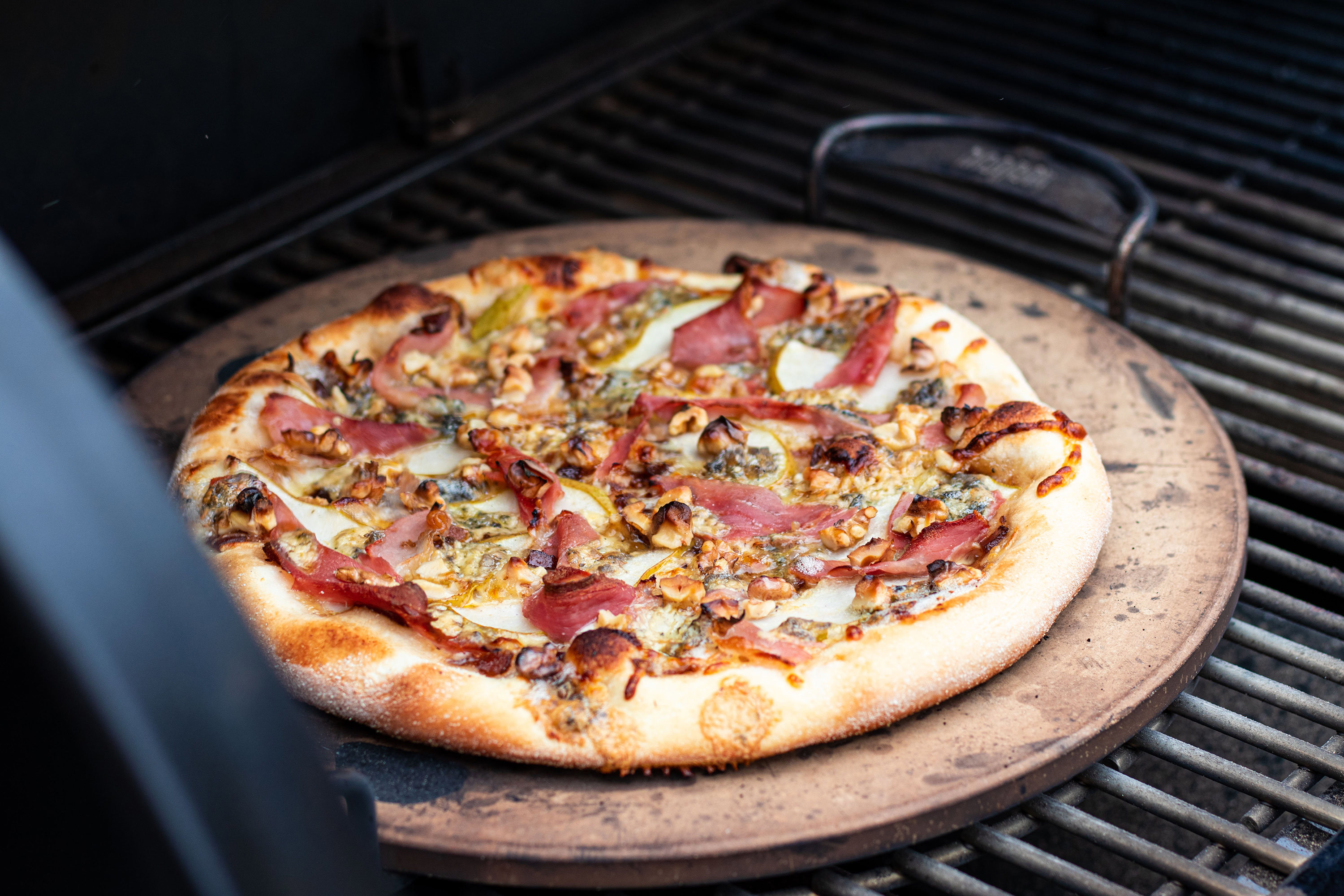 Caramelised Onion, Pear, Blue Cheese, And Prosciutto Pizza with Walnut and Rocket 