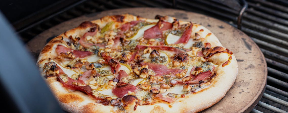 Caramelised Onion Pear Blue Cheese And Prosciutto Pizza