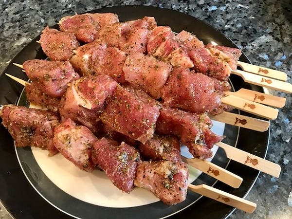 Prepping Kabobs - raw pork kabobs on the skewer - How To Grill Kabobs